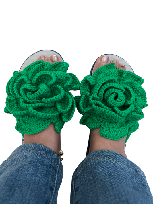 Grey flip flops with big green crochet flower